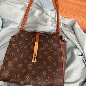 Purse. Small brown with beige. Hasn’t been used.